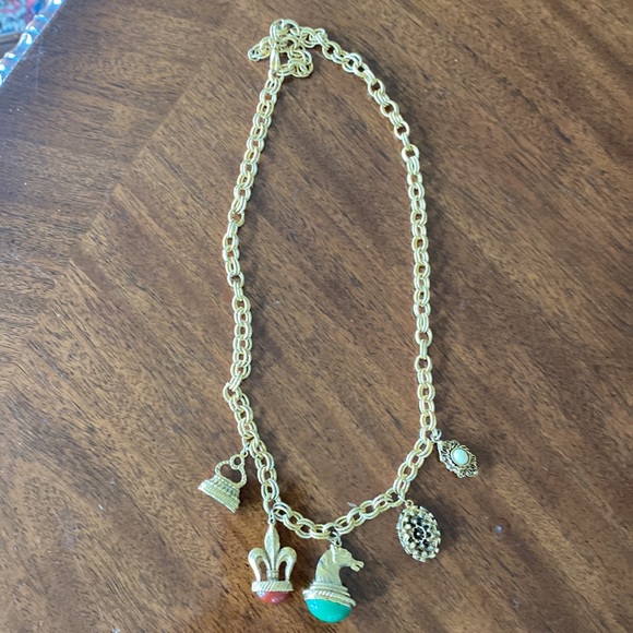 Gold tone charm necklace. Adjustable length. Great condition. - Picture 10 of 10